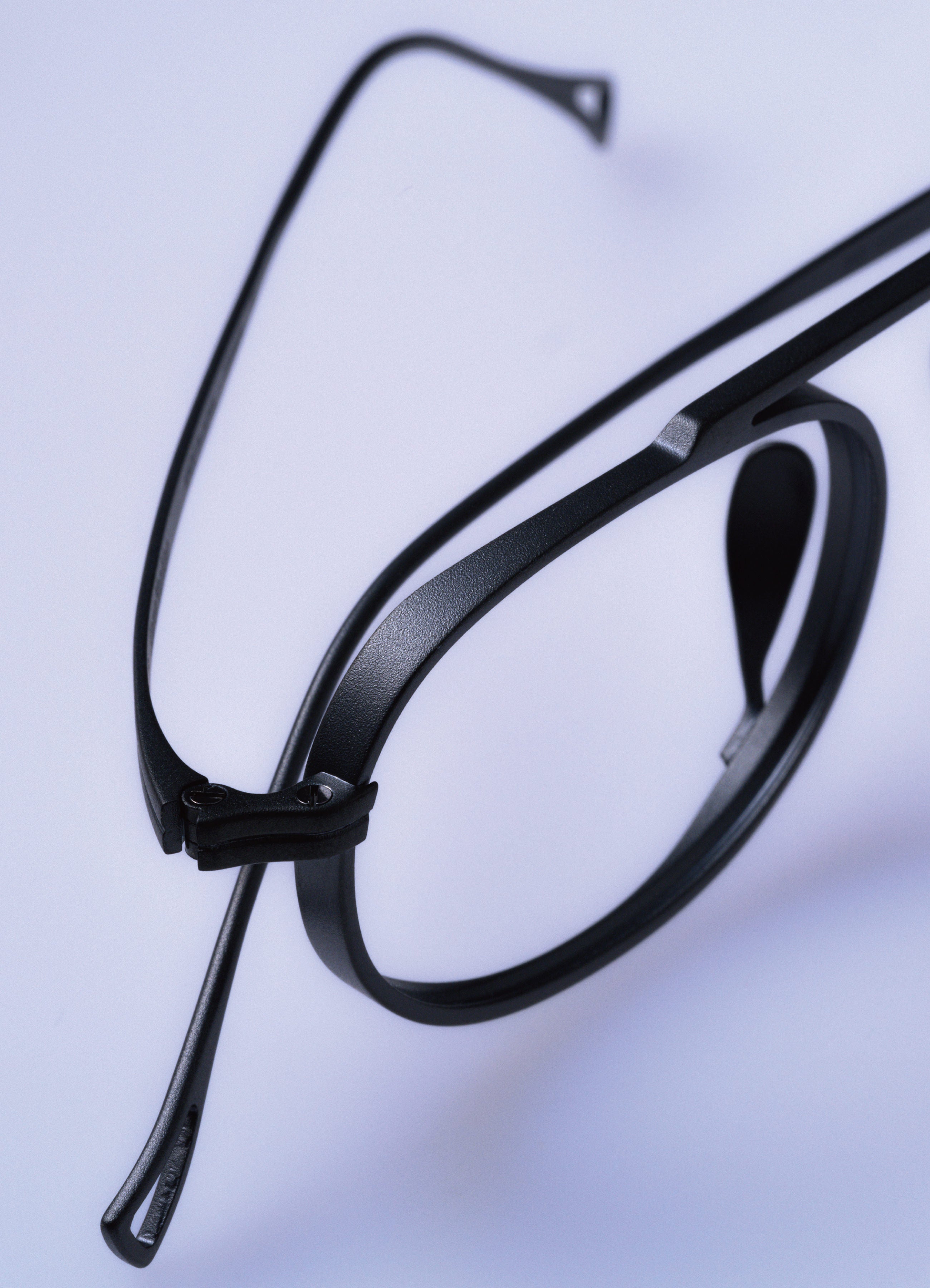 Black eyeglasses on a light gray background