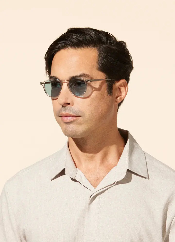 Man wearing Hampton sunglasses with a beige background