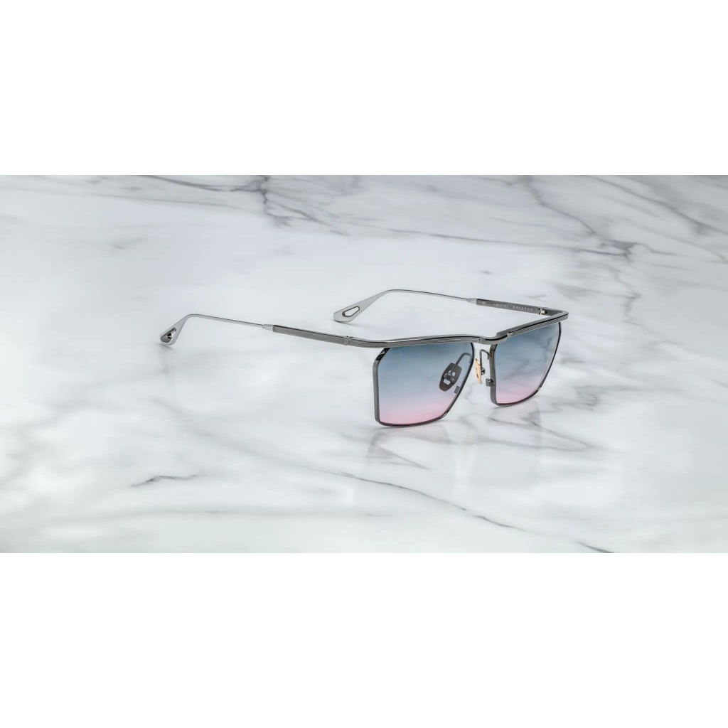 This image features a sophisticated pair of sunglasses named BRESSON. The sunglasses display a sleek, metallic frame with a minimalistic design, enhancing their elegant appeal.