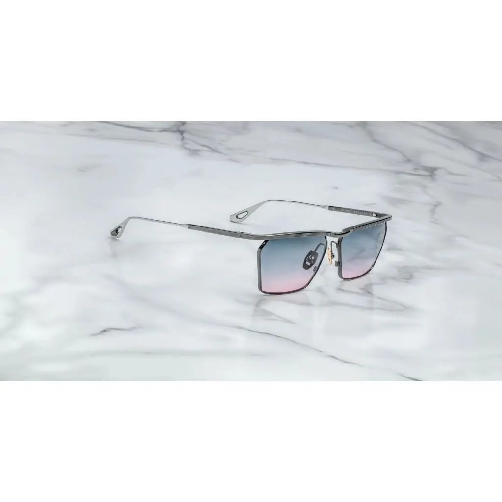 This image features a sophisticated pair of sunglasses named BRESSON. The sunglasses display a sleek, metallic frame with a minimalistic design, enhancing their elegant appeal.