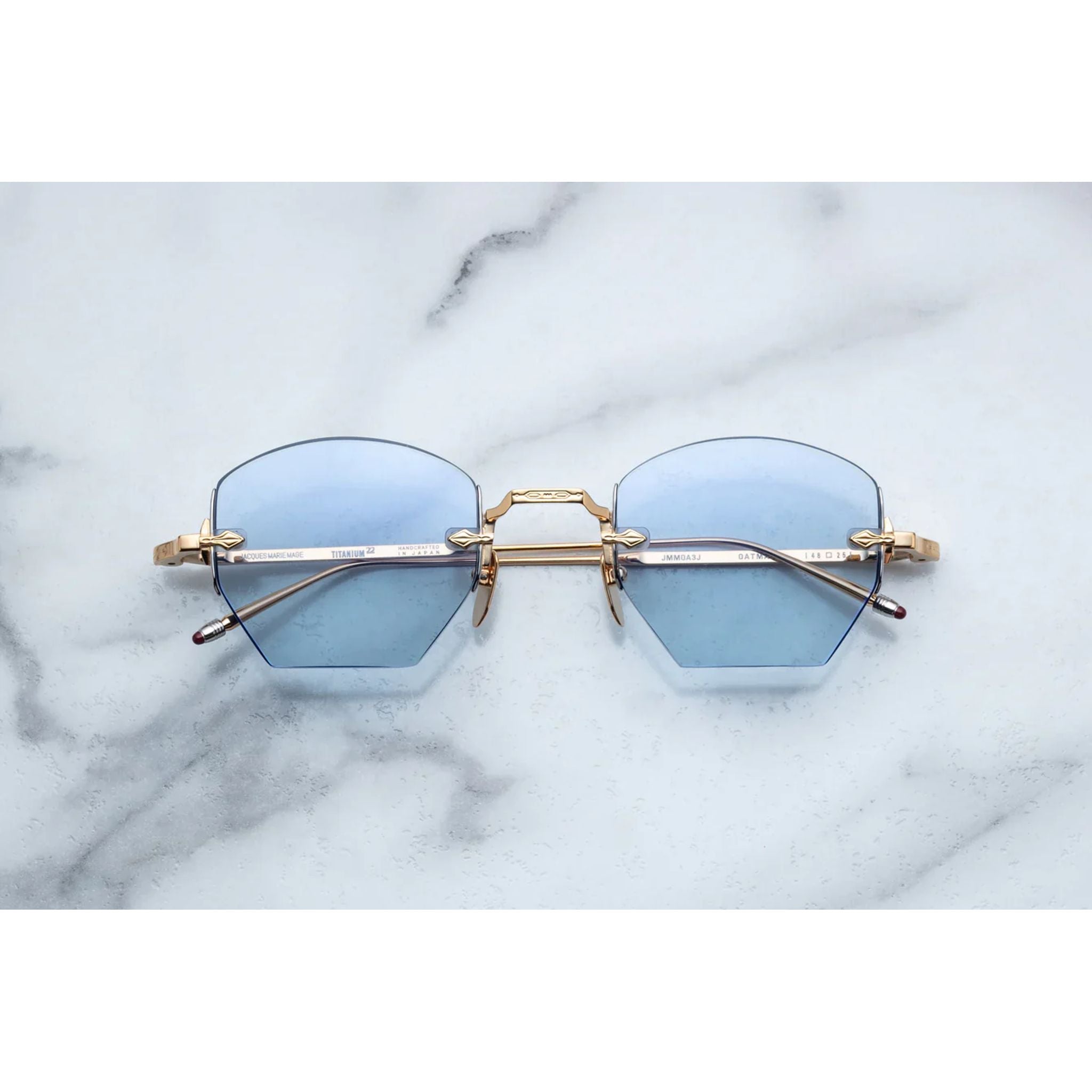 rimless sunglasses with gold details
