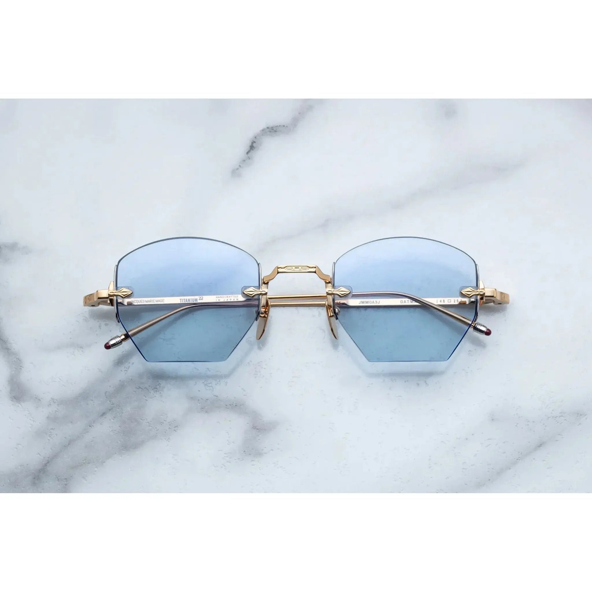 rimless sunglasses with gold details