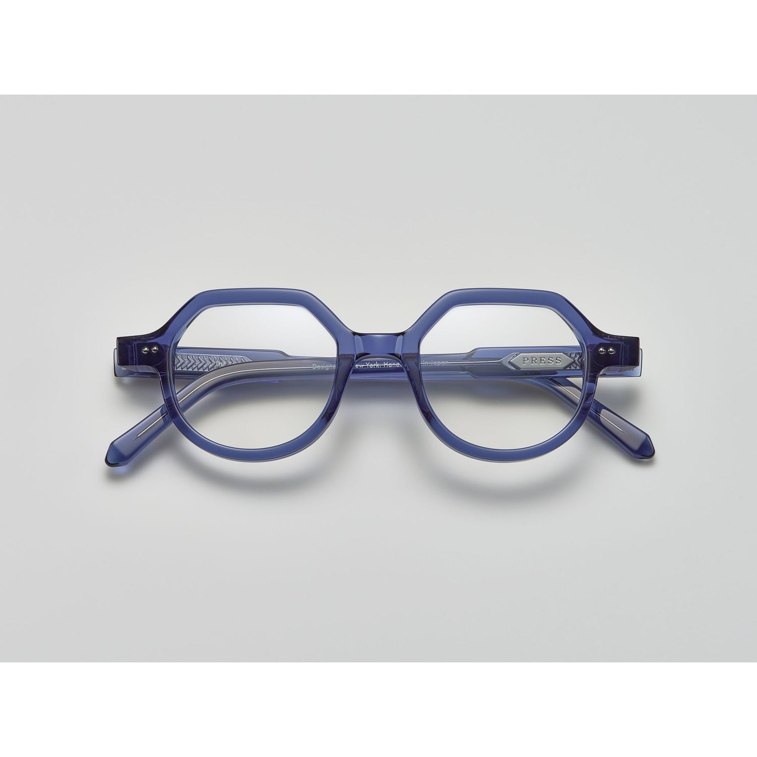 blue crystal acetate eyeglasses with round and subtly geometric frames, featuring the brand name "PRESS" on the temple, by Yosemite Eyewear