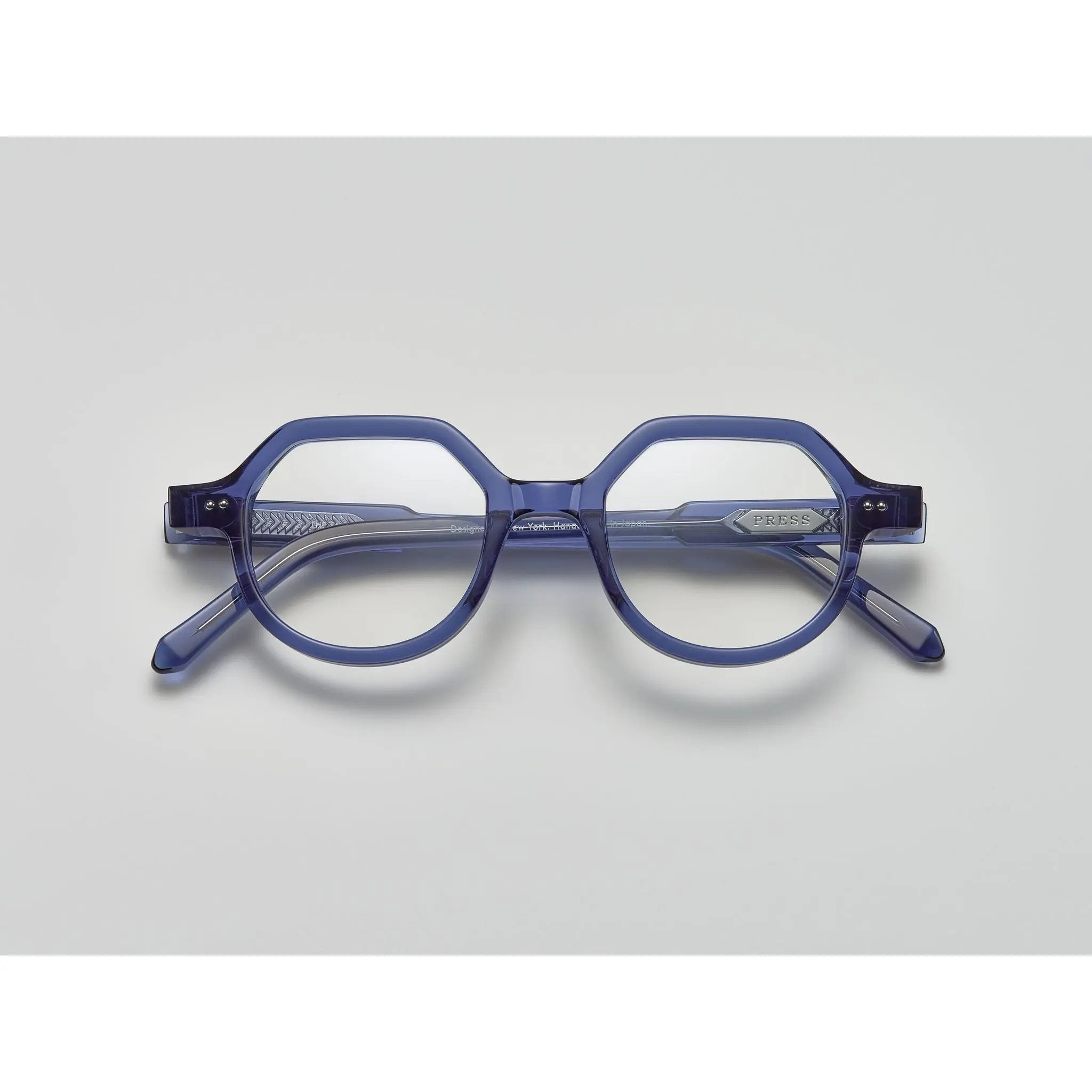 blue crystal acetate eyeglasses with round and subtly geometric frames, featuring the brand name "PRESS" on the temple, by Yosemite Eyewear