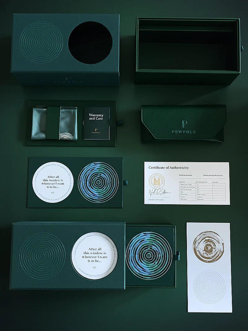 Collection of green and black packaging items on a dark green background