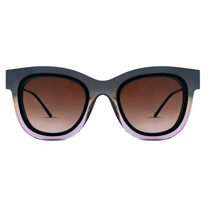 Cat-eye sunglasses with a translucent dark gray and lavender gradient frame and brown gradient lenses, thierry lasry