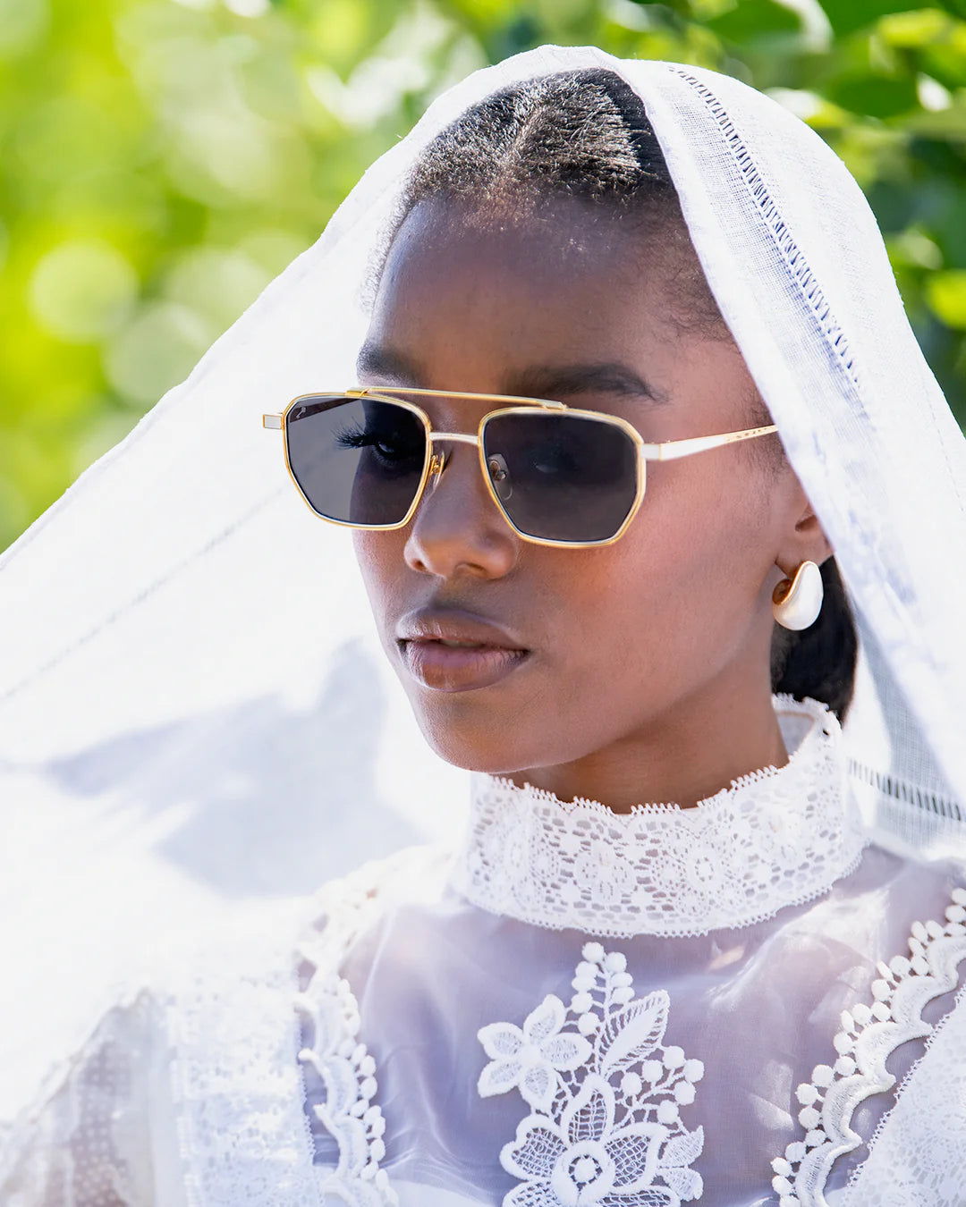 WOMAN WEARING LEISURE SOCIETY SUNGLASSES PRISM