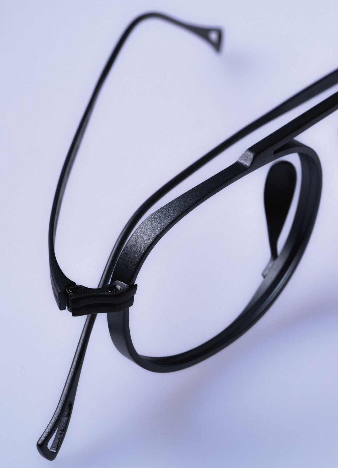 Black eyeglasses on a light gray background