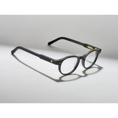 Black eyeglasses on a light gray background
