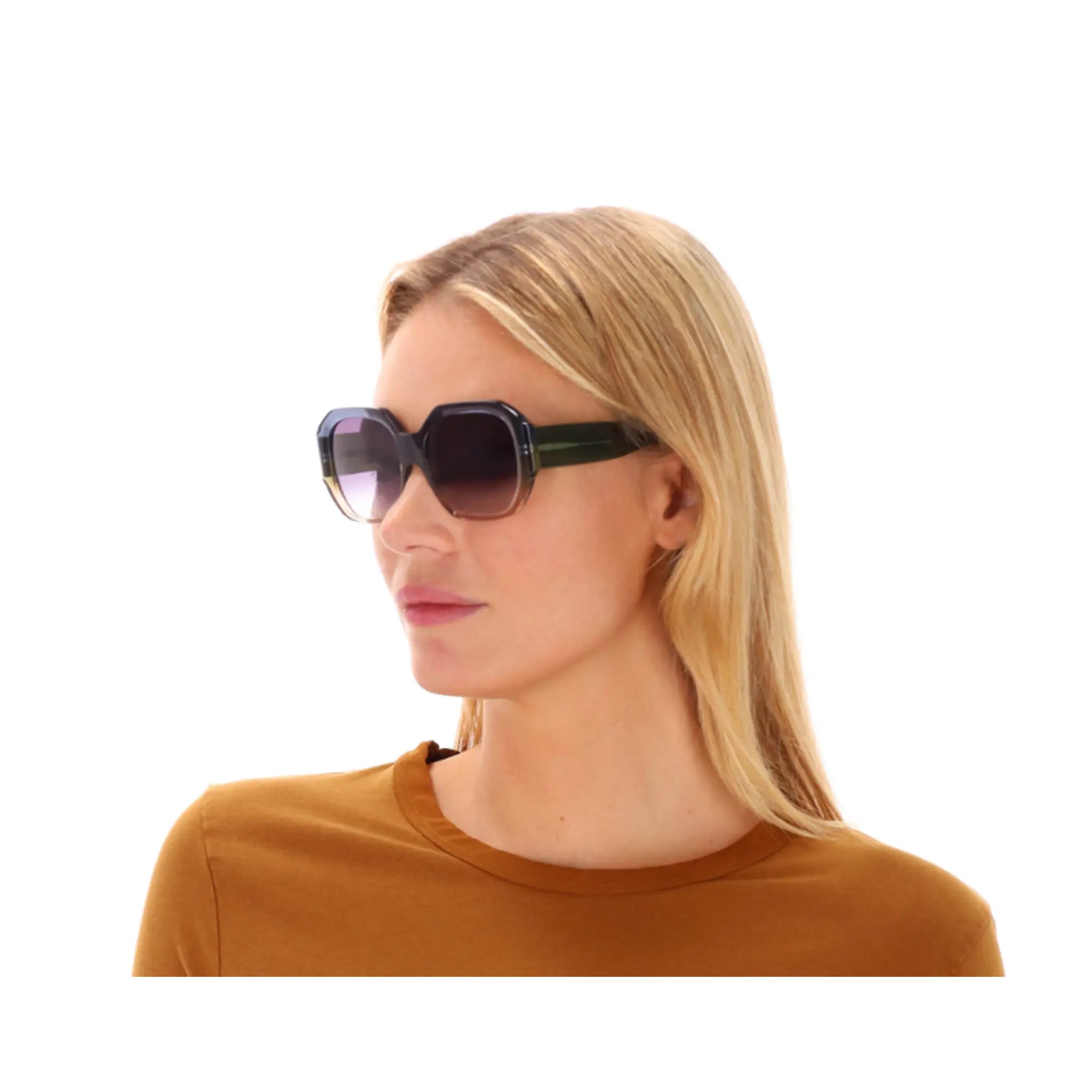 Woman wearing sunglasses with a plain white background