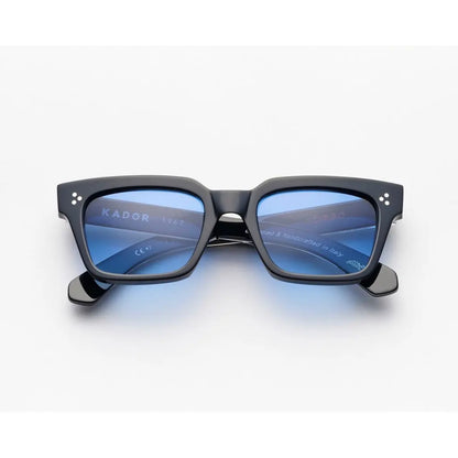 Black sunglasses with blue lenses on a white background kador guapo
